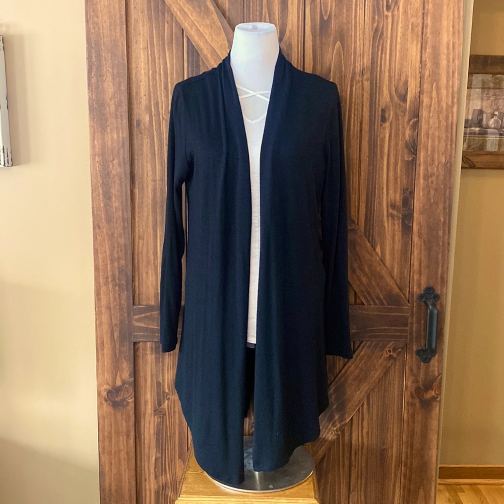 Lighter weight black cardigan. Mid length